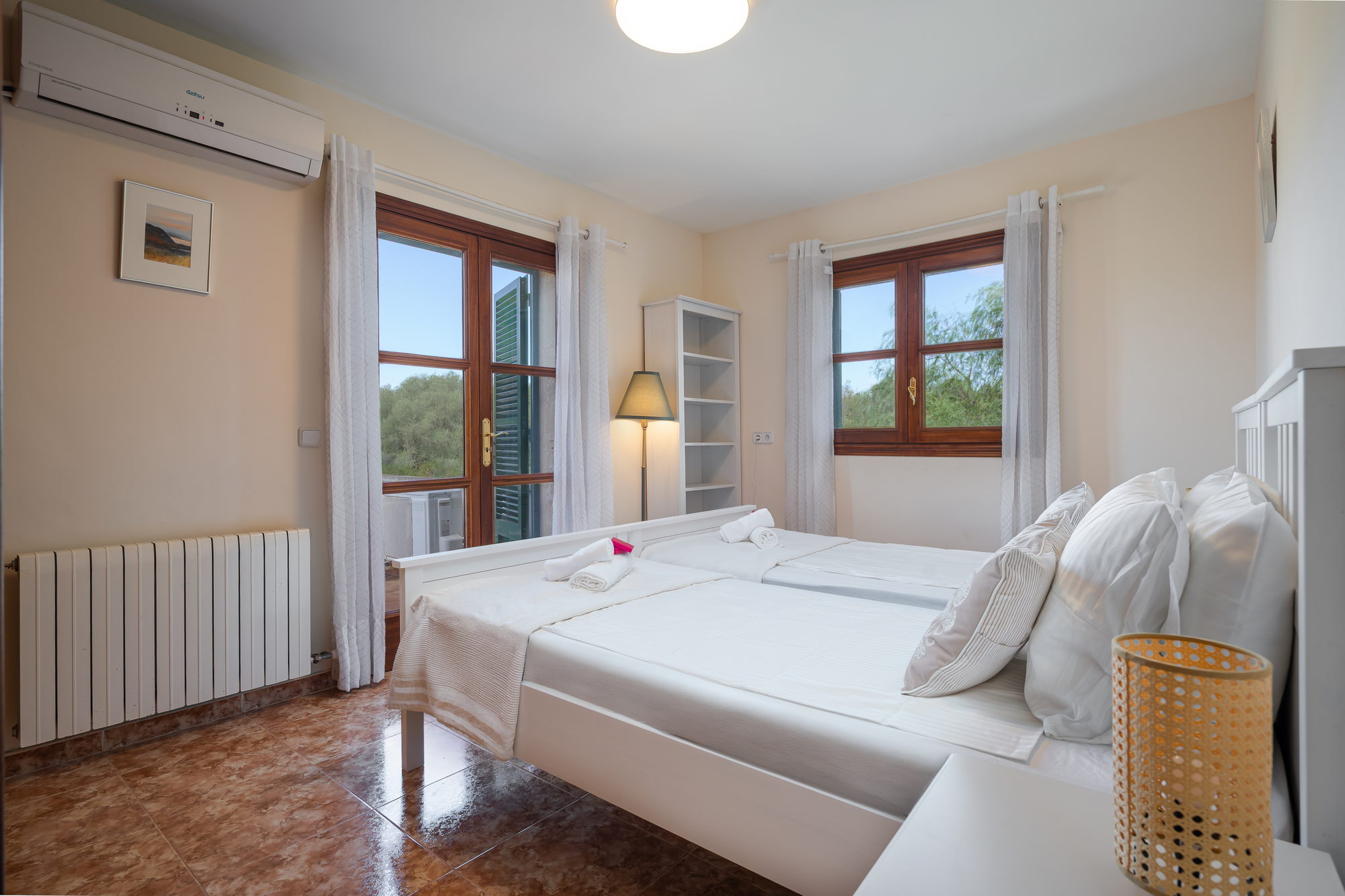 Vega, a twin bedroom with French doors